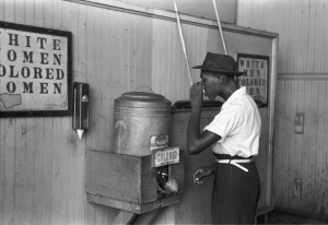 "Colored"_drinking_fountain_from_mid-20th_century_with_african-american_drinking