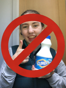 Student giving the thumbs up and holding bleach