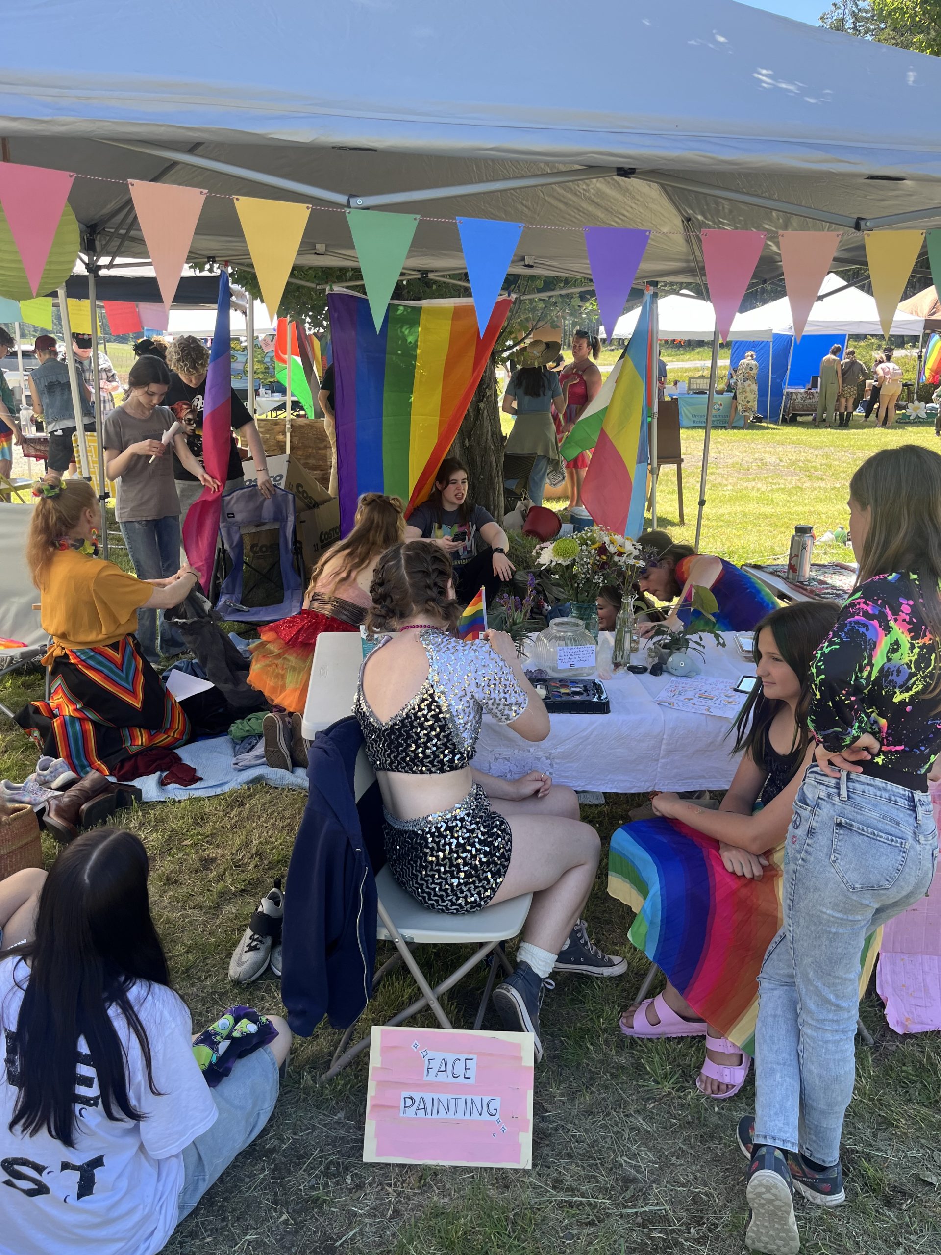 People at a booth in the Orcas Pride day festival 2025 / Maddie Olsen